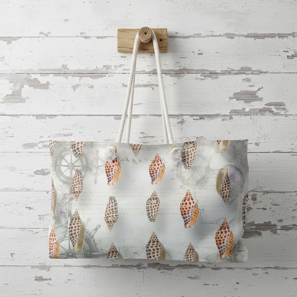 Tote bag with shell pattern hanging on a wooden hook against a rustic wooden wall.