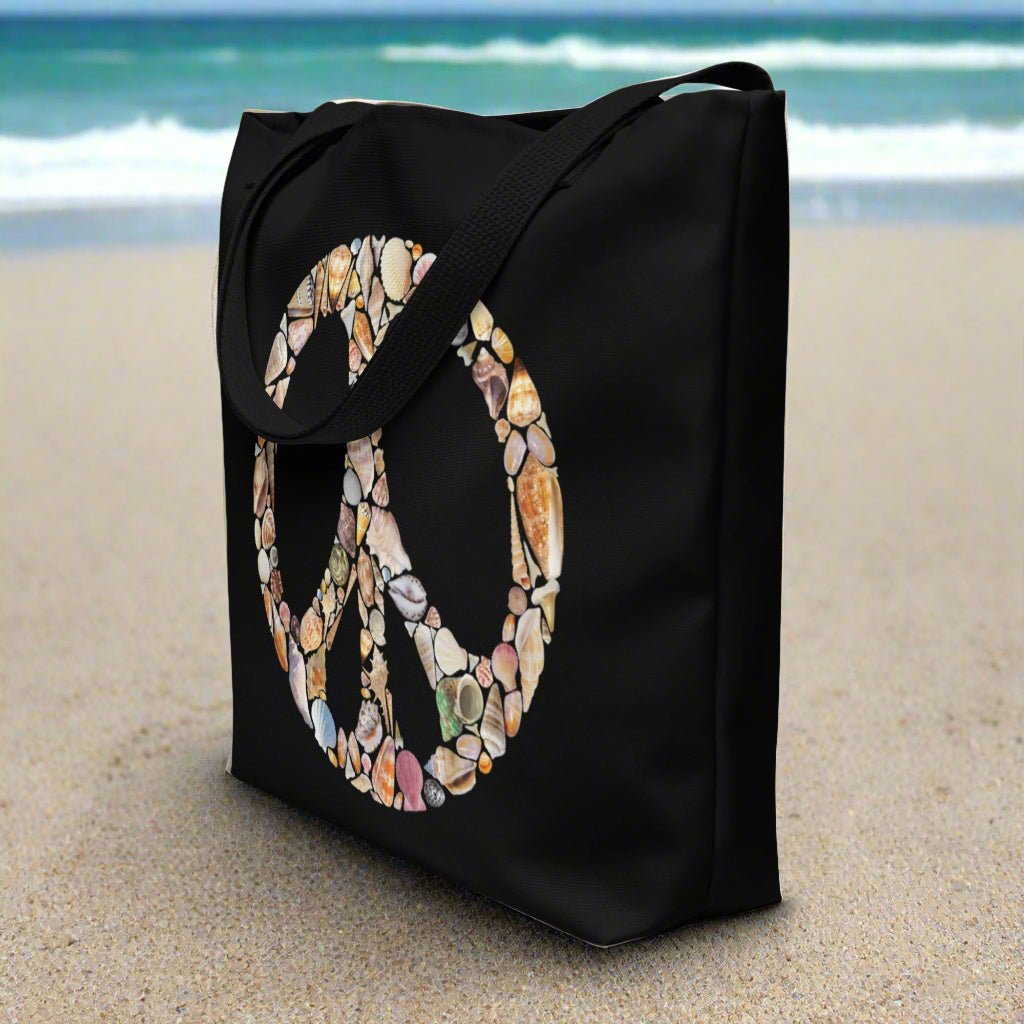 Black Tote Bag featuring a Peace Sign created out of seashells sitting in the sands of the Florida Coast