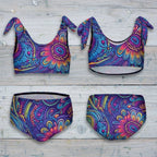 Colorful bikini set with a paisley pattern on a rustic nautical wood background