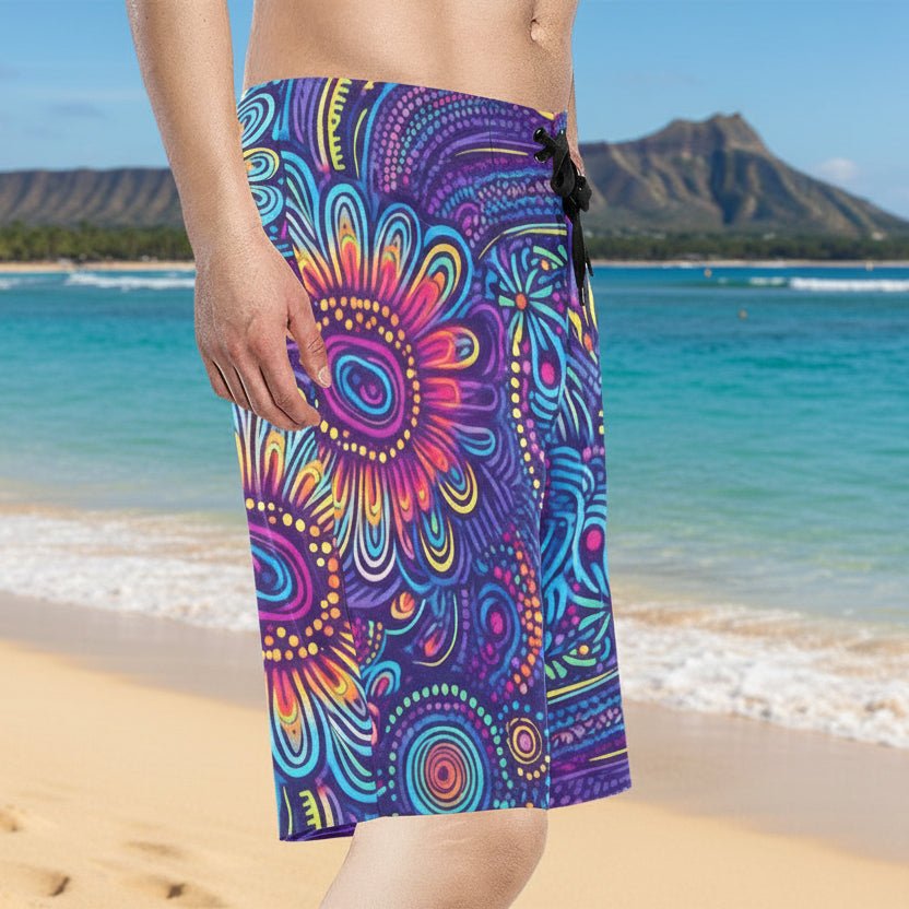 Surfer wearing Colorful psychedelic tiki patterned shorts on Waikiki Beach