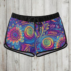 Colorful tribal patterned shorts on a wooden surface