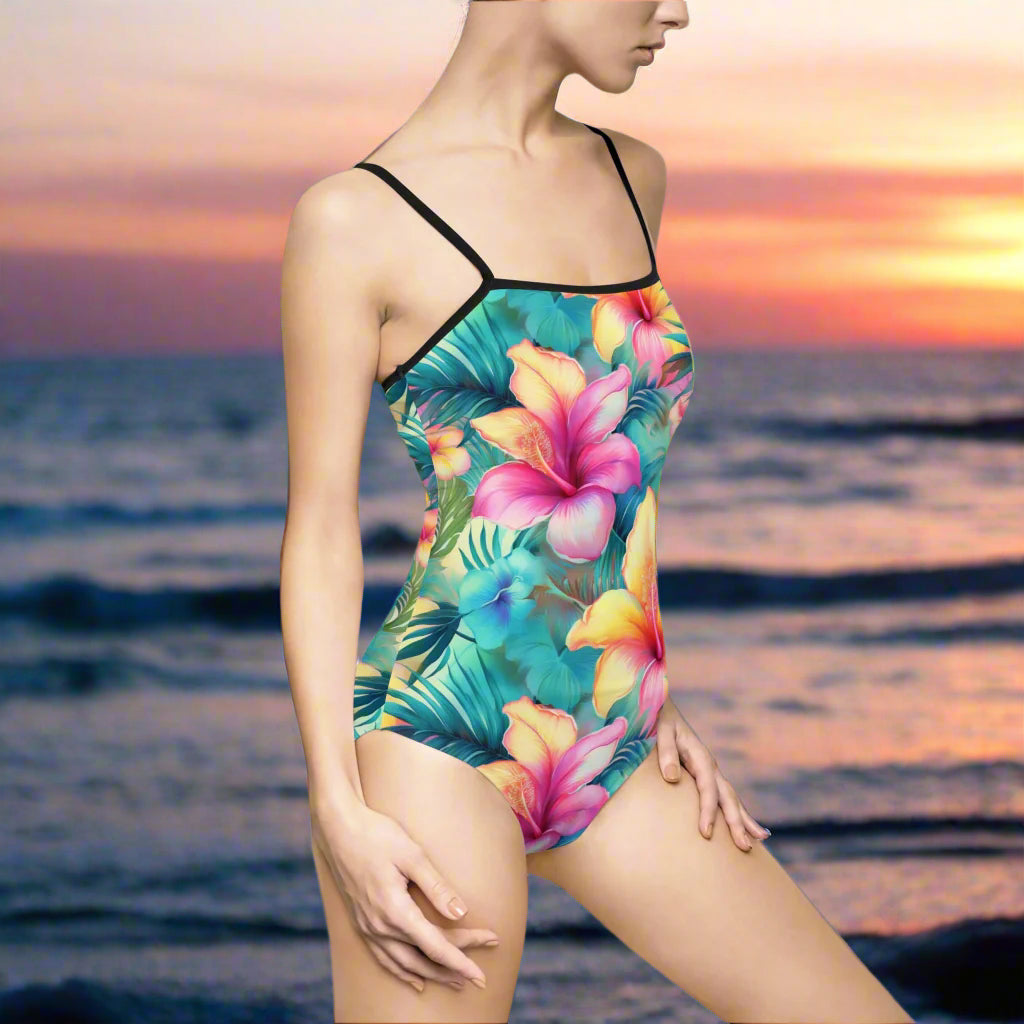 Sweet Tropical Floral Pattern on one piece swimsuit worn by a hot model on the beach