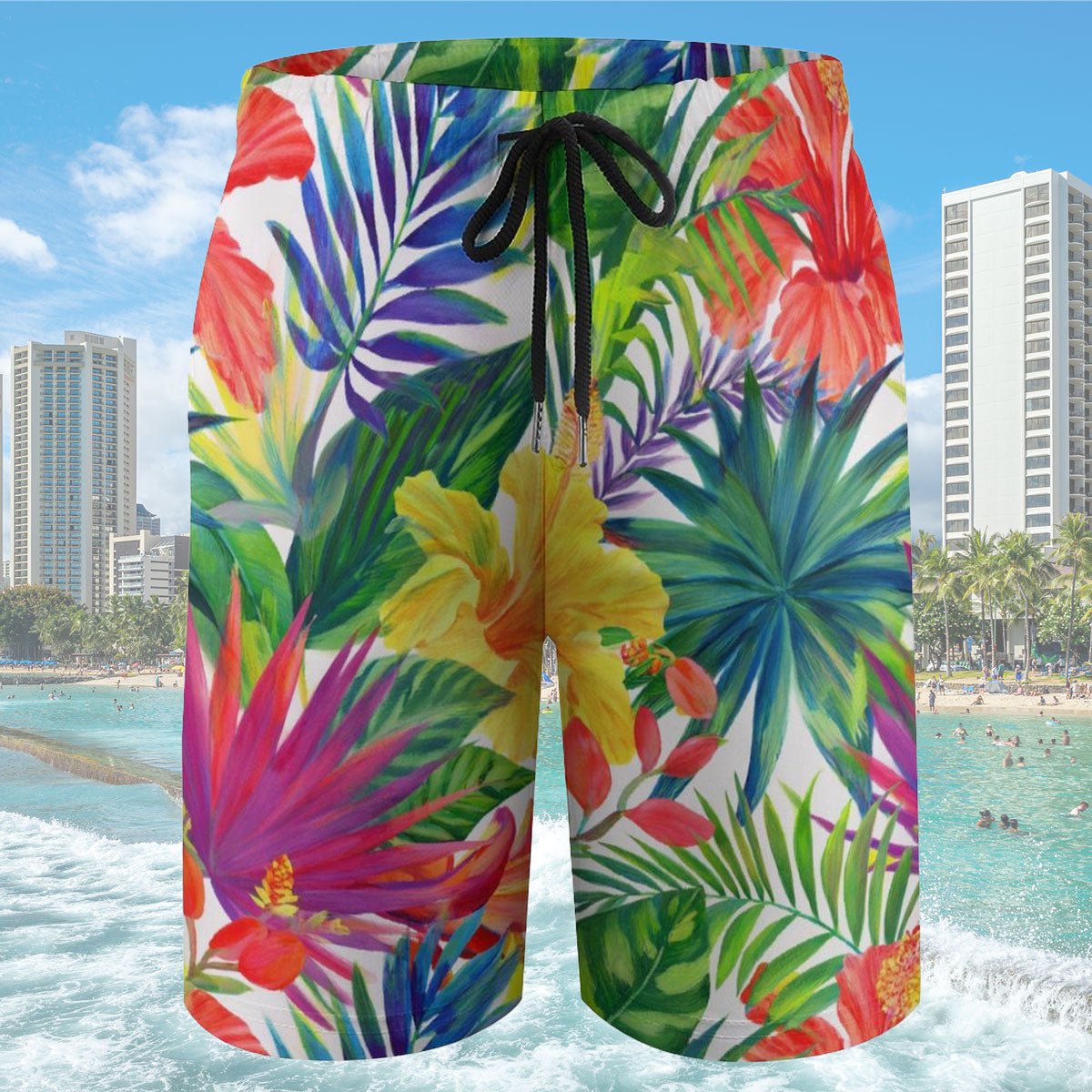 Colorful tropical floral shorts with a beach and cityscape in the background