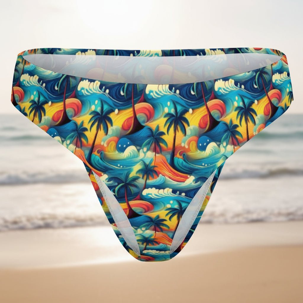 Colorful tropical-themed swim briefs on a faded beach background