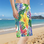 Dude wearing Colorful Hawaiian style tropical floral patterned board shorts in a beach in Hawaii