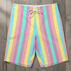 Tropical Pastel striped board shorts on a rustic wood background