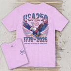 Pink t-shirt with eagle and 'USA 250' design on a wooden surface