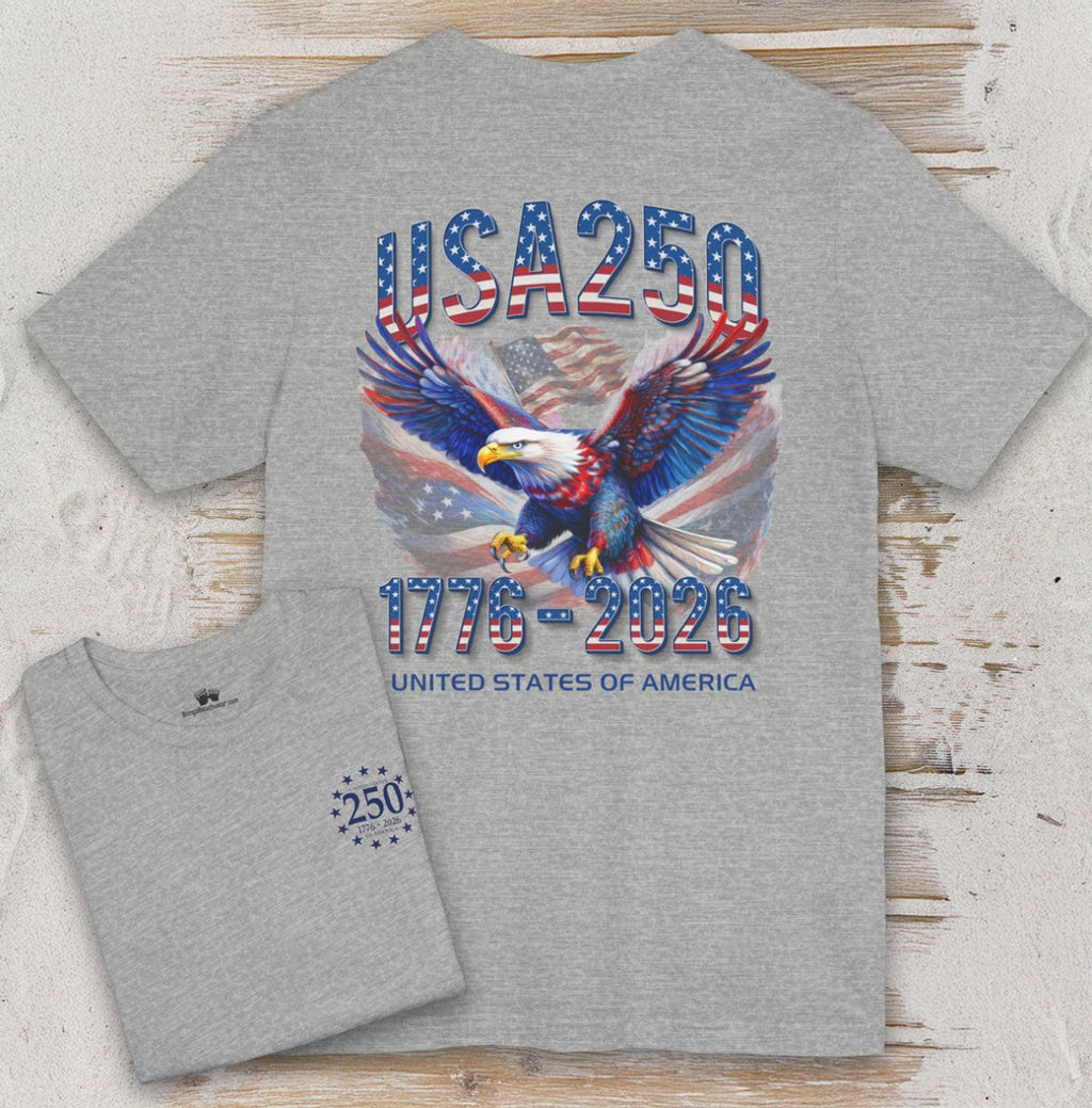 Gray t-shirt with USA 250 design featuring an eagle and American flag on a wooden surface