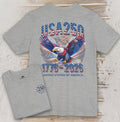 Gray t-shirt with USA 250 design featuring an eagle and American flag on a wooden surface