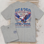 Gray t-shirt with USA 250 design featuring an eagle and American flag on a wooden surface