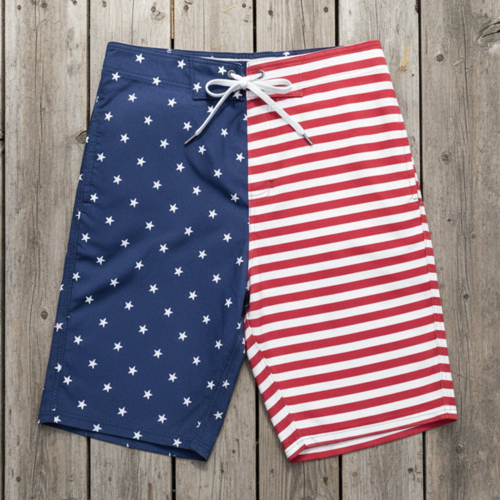 Men's American flag pattern board shorts on a rustic wood deck