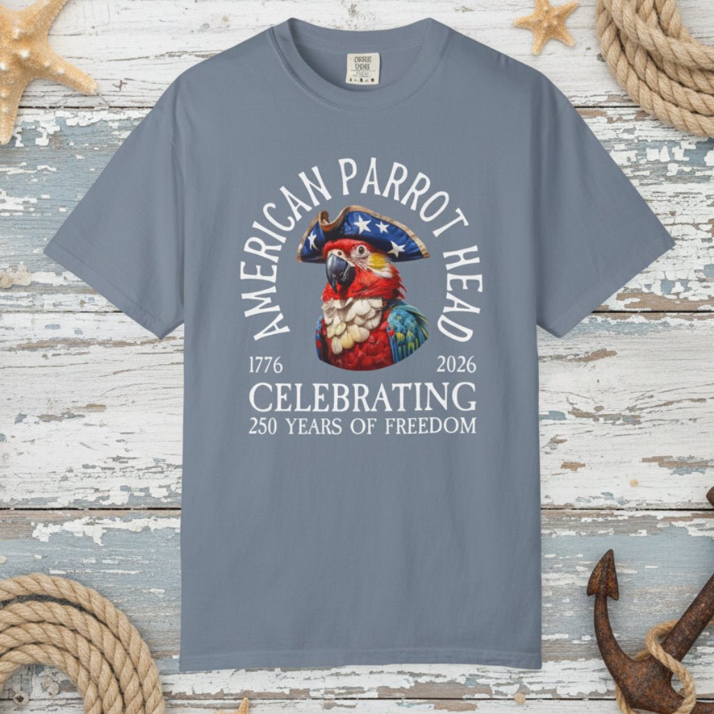 Gray t-shirt with a parrot graphic and text on a nautical wood background
