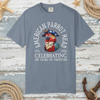 Gray t-shirt with a parrot graphic and text on a nautical wood background