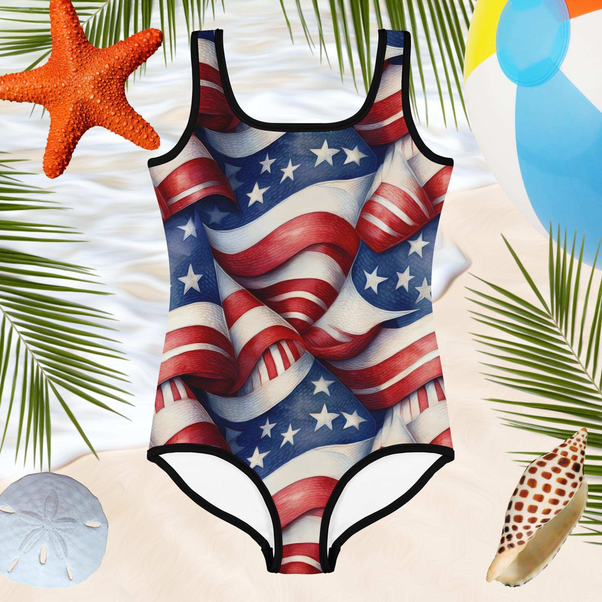 Girls one-piece bathingsuit haning over a beach with sand dollars and seashells with a beach ball near by
