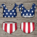 Bikini set with American flag design on a rustic wood background