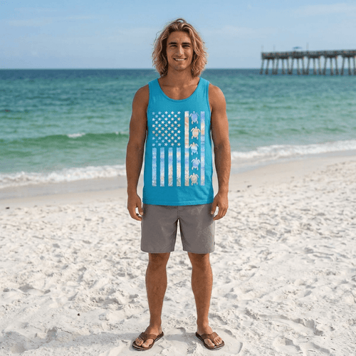 Dude wearing a blue turtle flag tank top with a graphic design on a beach