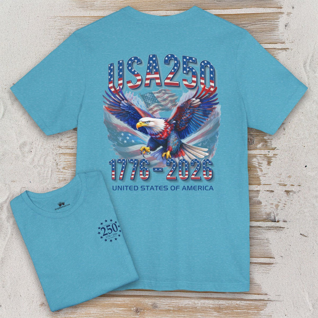 Teal t-shirt with eagle and 'USA 250' design on a wooden surface