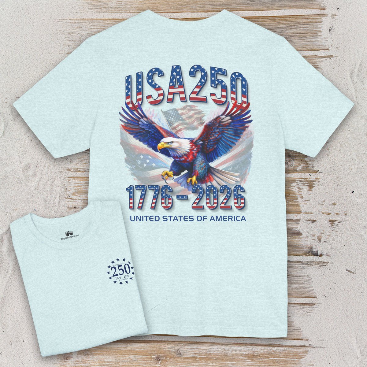 Light blue t-shirt with eagle graphic and 'USA 250' text on a wooden surface