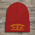 Black beanie with United States Navy 250 Anniversary on a rustic wood background