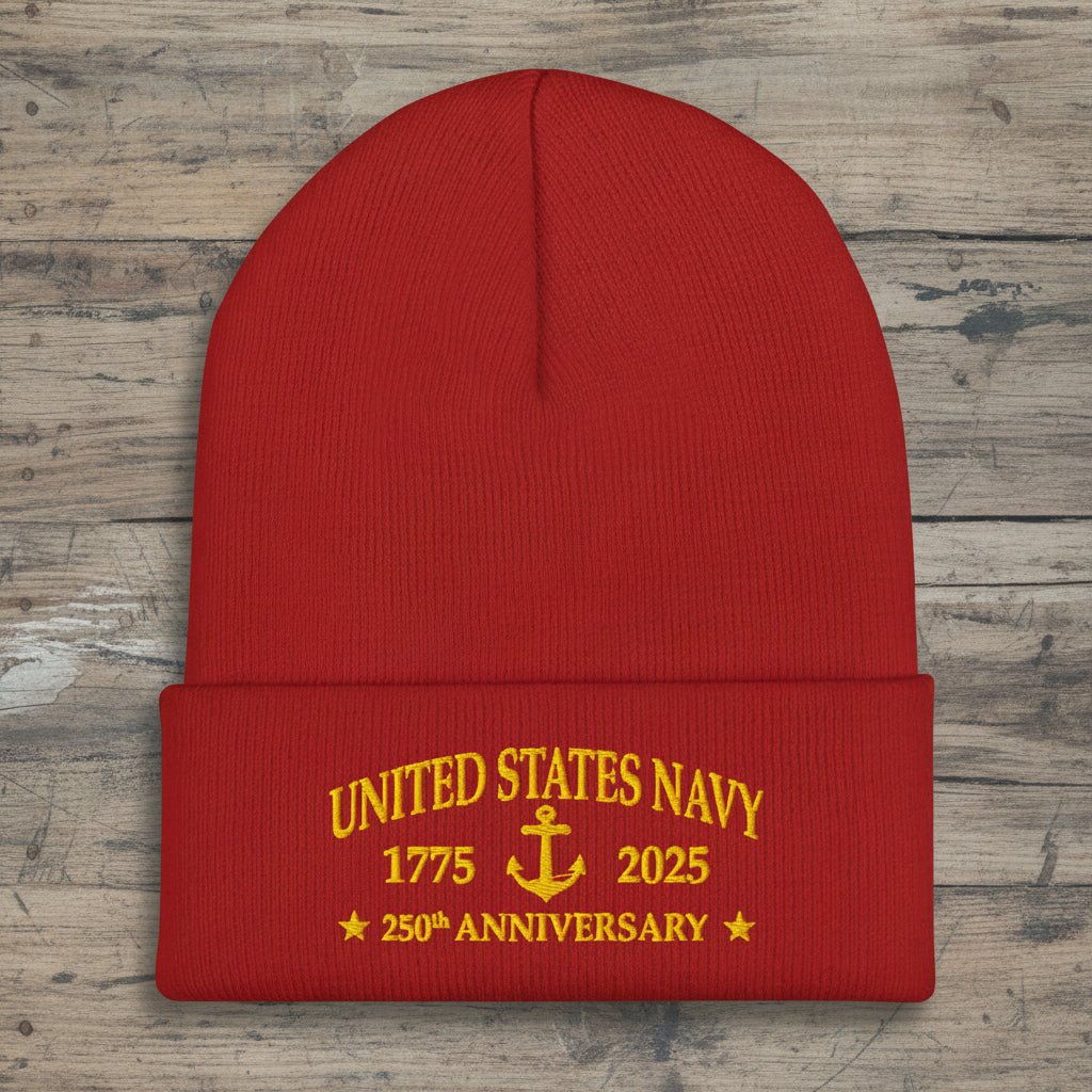Black beanie with United States Navy 250 Anniversary on a rustic wood background