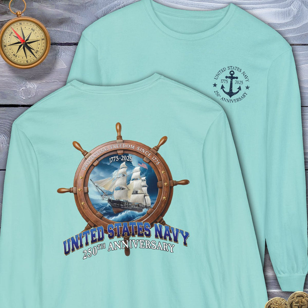Light blue long-sleeve shirt with United States Navy 250th Anniversary design on a wooden surface.
