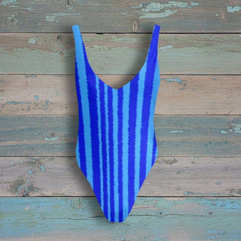 Blue striped swimsuit on a rustic wood background