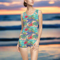 Model Wearing Vinage One Piece Swimsuit with classic Hawaiian Style Pattern standing on the beach