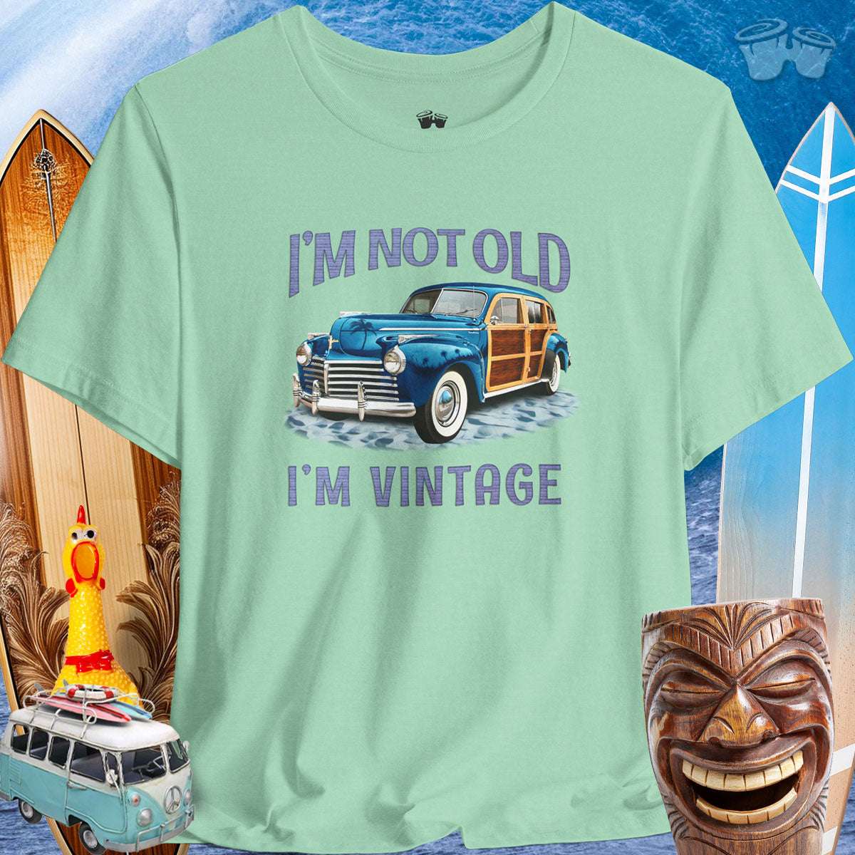 Vintage Cars | Woody Surf Wagon T-Shirt 🤙T-Shirt Over a Surfing Background with surfboards Beach wagons and a Rubber Chicken
