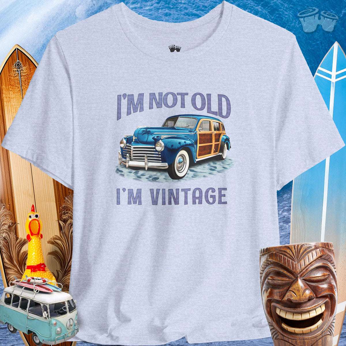 Vintage Cars | Woody Surf Wagon T-Shirt 🤙T-Shirt Over a Surfing Background with surfboards Beach wagons and a Rubber Chicken