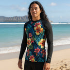 Surfer Dude wearing a black long-sleeve rash guard with a colorful floral design on Waikiki Beach Hawaii