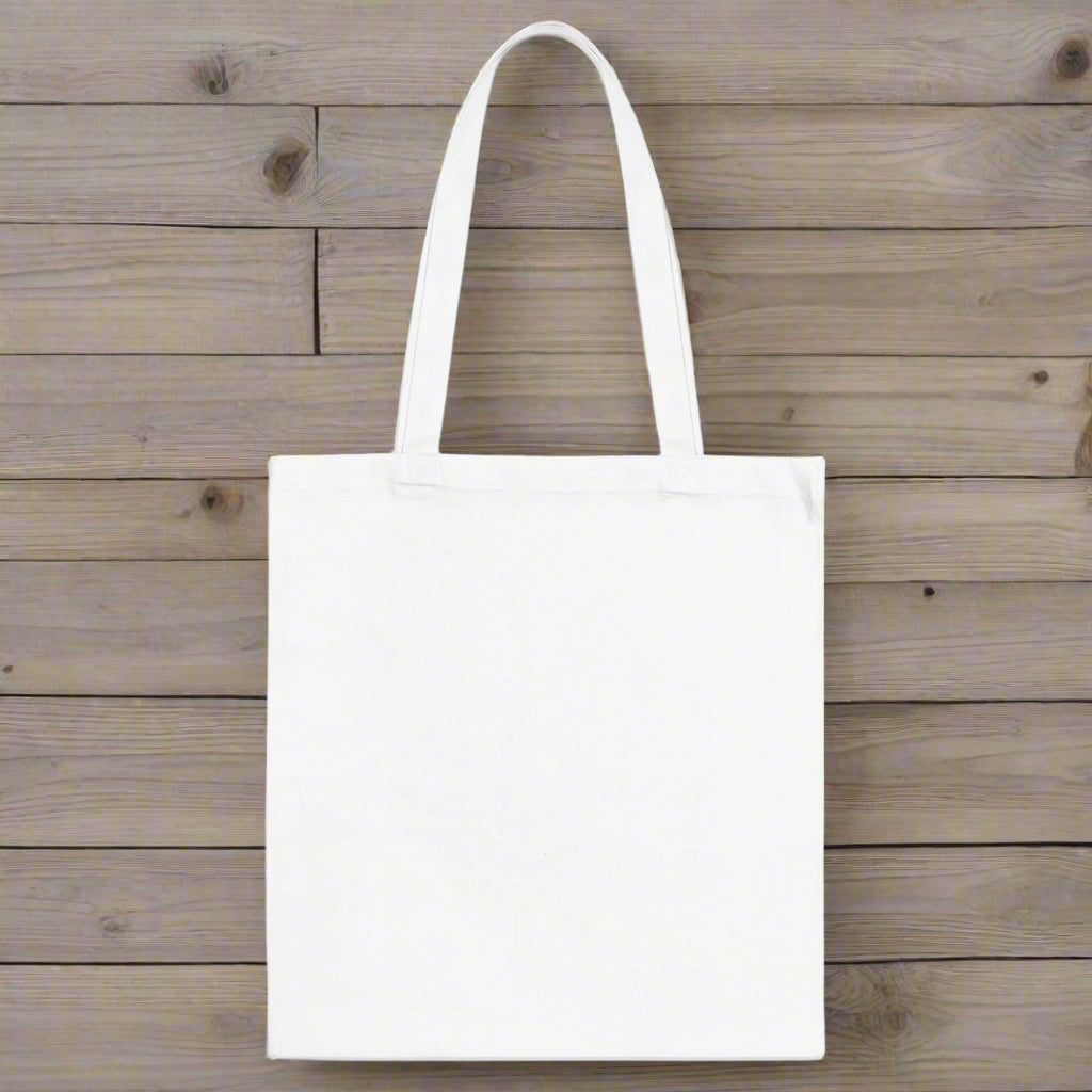 blank side of white canvas tote bag on a rustic nautical wood background