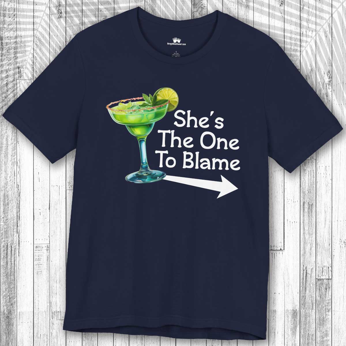Navy blue  Margarita Party Tee with a green cocktail graphic and text 'She's The One To Blame' on a wooden surface.