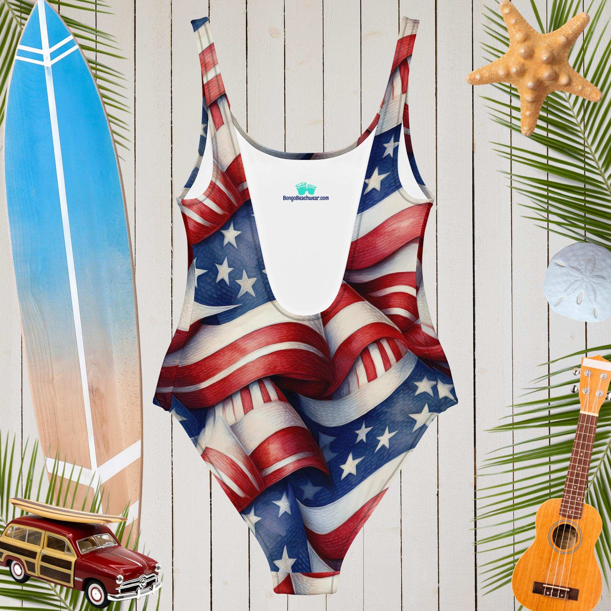 Low cut back on Americana USA Flag pattern swimsuit hanging in front of a rustic wood wall of a seaside surf Shack