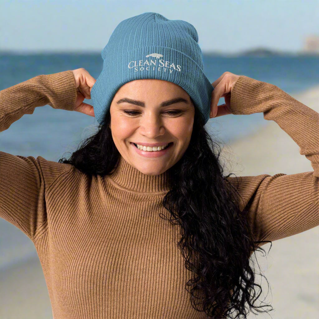 Girl wearing an Organic Ribbed Beanie with Clean Seas Society logo getting ready for a beach clean up party in Long Island