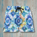 Colorful tie-dye shorts on a wooden surface