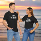 Couple Wearing Bela Canvas Tee Shirts that say "Yo Ho Ho and a bottle of bad ideas" standing on a bech at sunset.