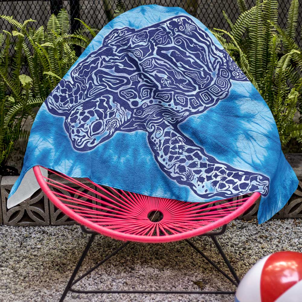 Zen Sea Turtle Beach Towel Draped Over a Pool Side Chair