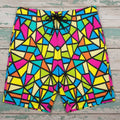 Colorful geometric patterned shorts laying flat on rustic nautical wood