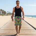 Dude wearing Colorful geometric patterned shorts on a beachside boardwalk