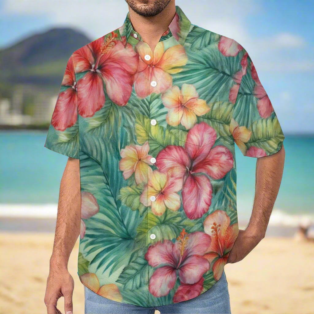 Dude in Tropical floral aloha shirt with pink flowers and green leaves on a beach in Waikiki