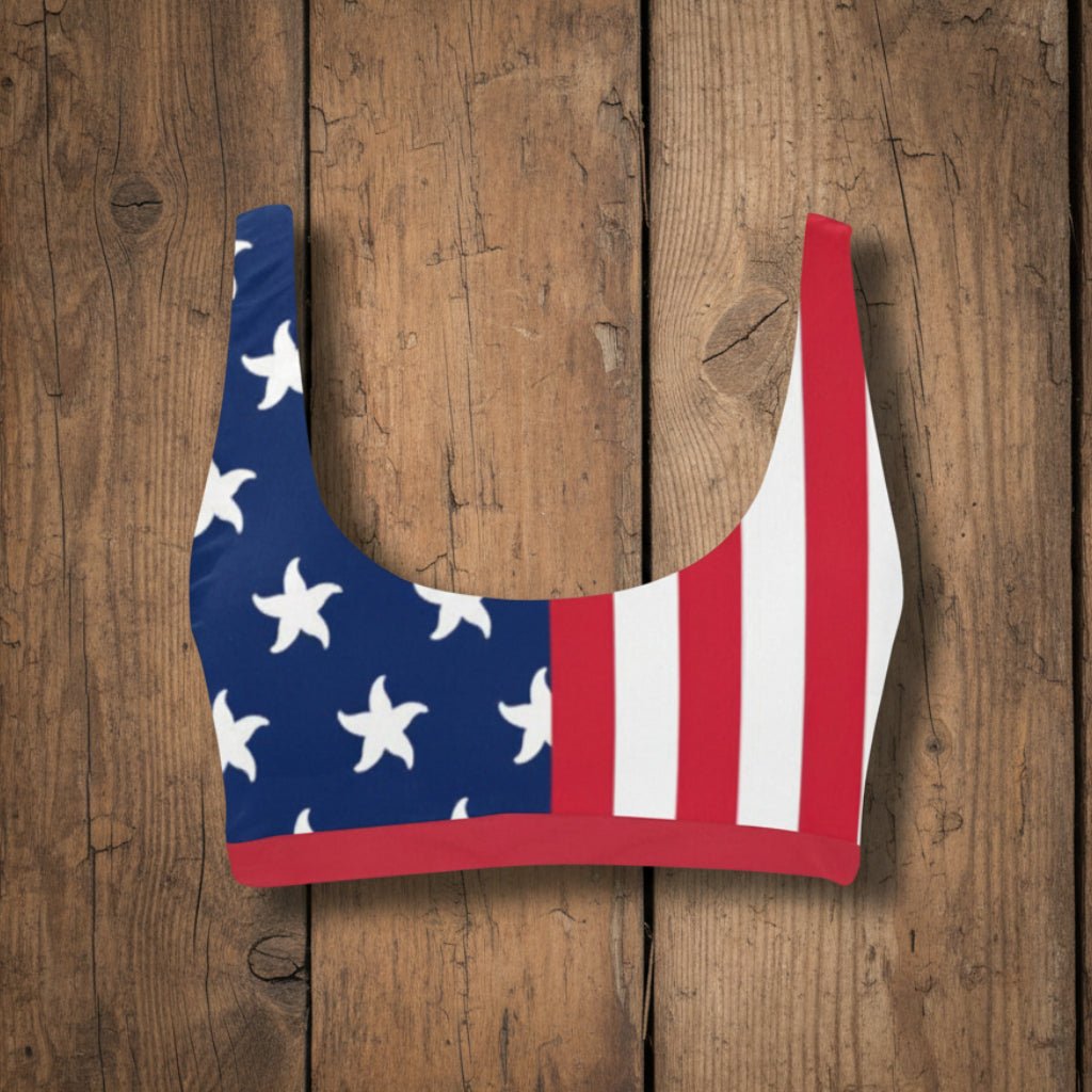 Bikini top with American flag design on a rustic wood background