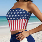 Beachwear Model wearing a strapless top with American flag design on a beach in Pensacola.