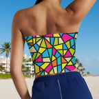 Colorful geometric-patterned strapless top worn by a beachwear model on Miami's South Beach