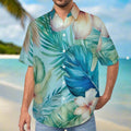 Man wearing a tropical leaf and flower patterned shirt on a beach in O'ahu