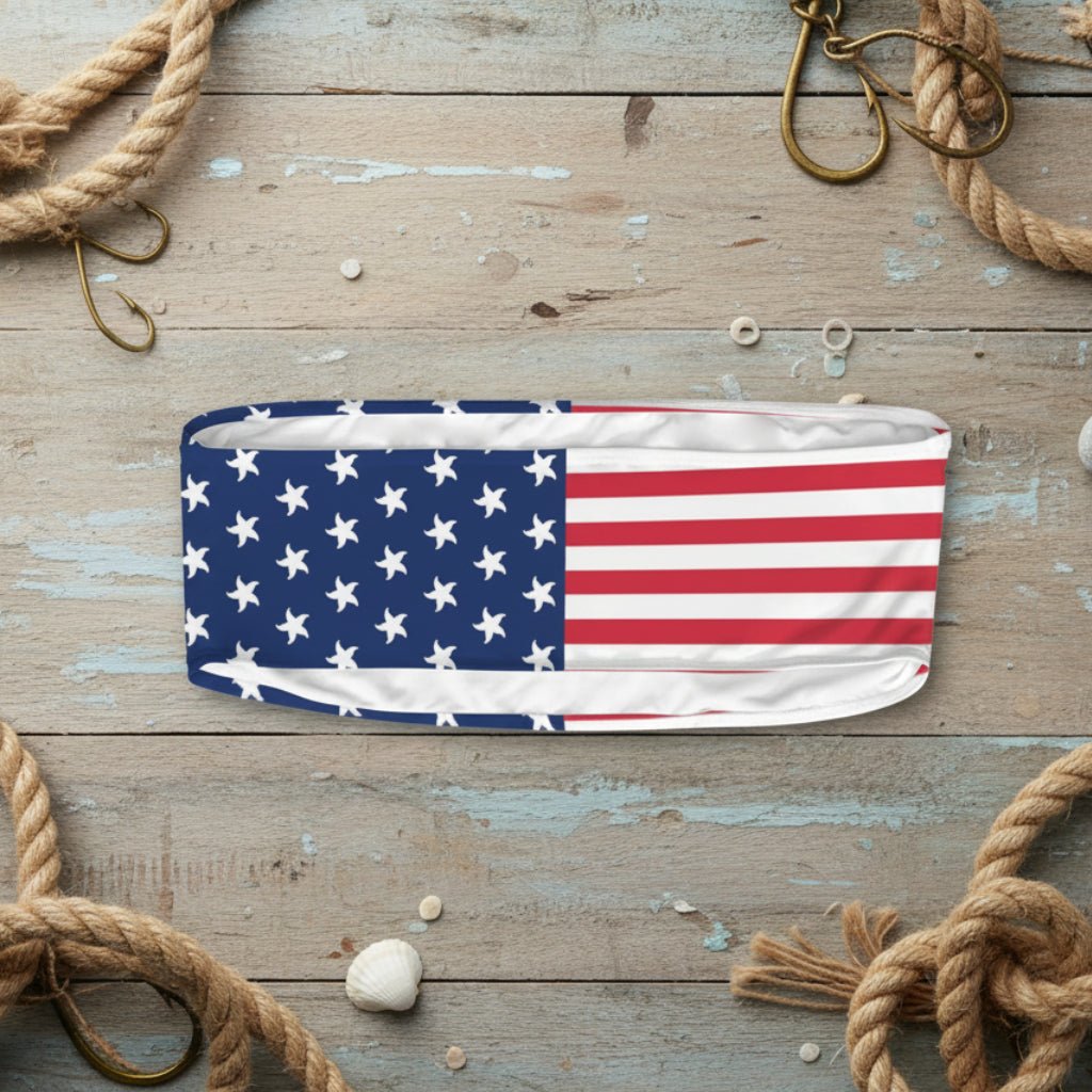 Headband with American flag design on a nautical wood background