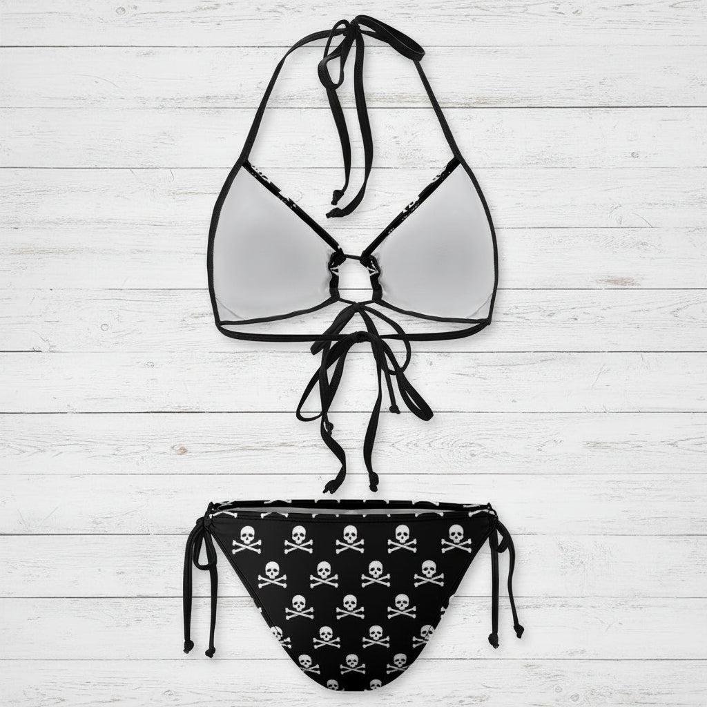 Black and white bikini set with skull and crossbones pattern on a white background