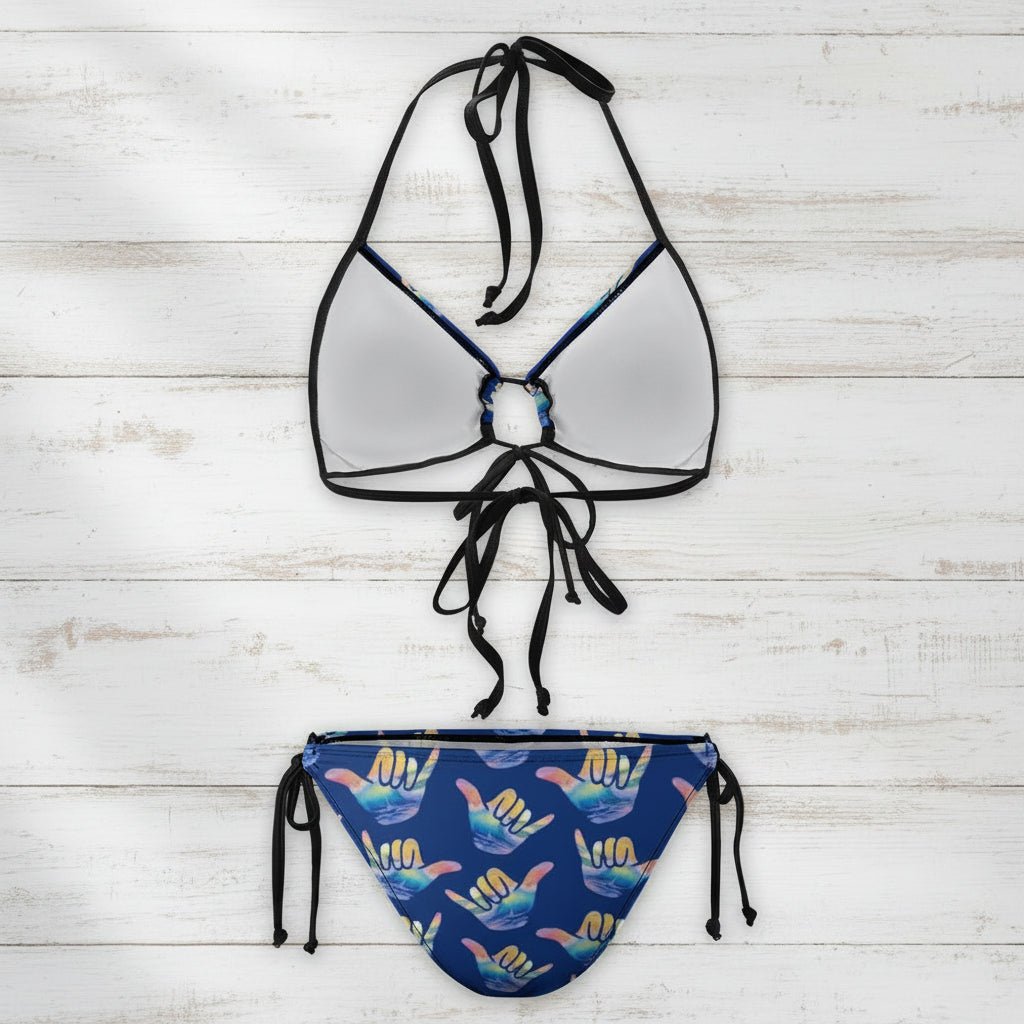 Bikini set with mirror-like top and colorful bottom on a white background