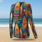 Colorful long-sleeve shirt with tropical design featuring masks and surfboards on a beach background.