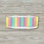 Pastel striped headband on a nautical wood background