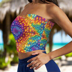 Colorful bandeau tie-dye strapless top worn by a beachwear model outside a beachside Tiki Hut